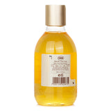 Sabon Ginger Orange Shower Oil in a 300ml plastic bottle; moisturizes with essential oils, leaves skin soft and refreshed.