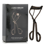 Laura Mercier Artist Eyelash Curler with wide-angle design, silicone pads, and double-handled grip for perfect lash curls.