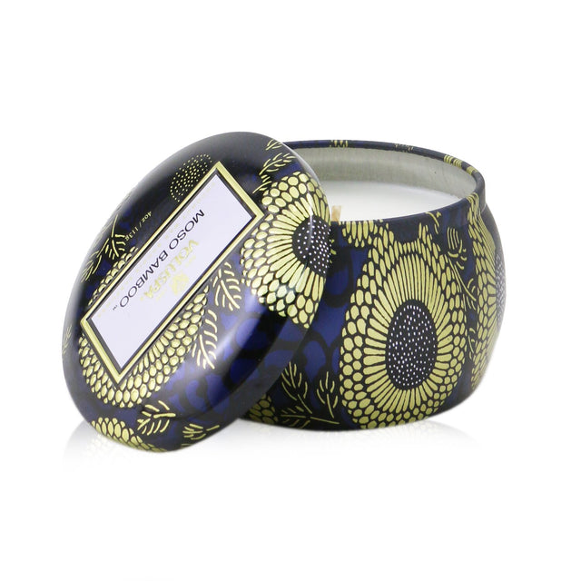 Mini tin candle in Moso Bamboo scent, featuring coconut wax blend and natural wicks, burns for 25 hours in a stylish metal tin.