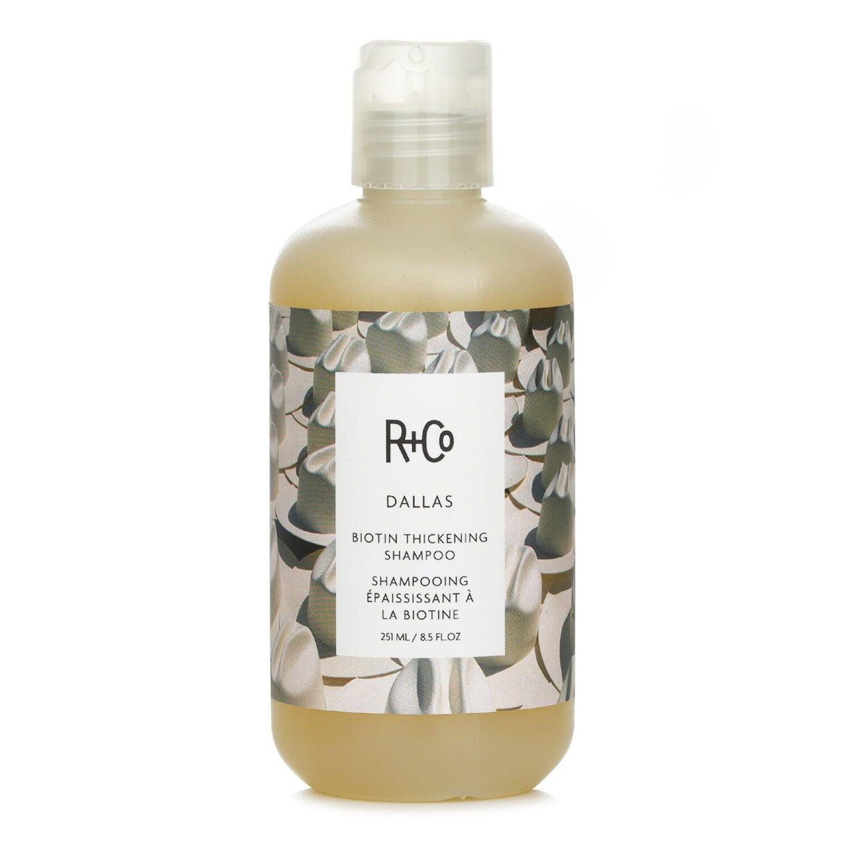 R+Co Dallas Biotin Thickening Shampoo - 241ml, designed to strengthen fine hair, adds volume and hydration with a romantic scent.