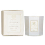 Luxurious hexagonal candle in soft white glass, featuring a floral blend of Damascena rose, orris, and oud for 60 hours of fragrance.