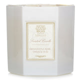 Elegant hexagonal candle with floral scent notes in a soft white glass container, offering 60 hours of aromatic ambiance.