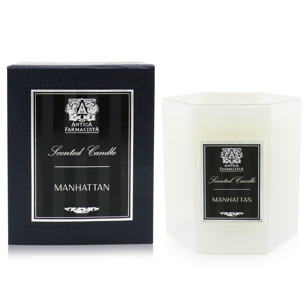 Luxurious Manhattan candle in a soft white glass container, offering 60 hours of aromatic elegance with vibrant, warm notes.