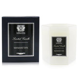 Luxurious Manhattan candle in a soft white glass container, offering 60 hours of aromatic elegance with vibrant, warm notes.