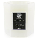 Antica Farmacista Manhattan Candle in a soft white glass, offering 60 hours of luxurious scent with vibrant notes.