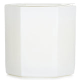 Elegant white candle in a glass holder with citrus floral scents of orange blossom, lilac, and jasmine for 60-hour ambiance.