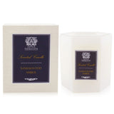 Luxurious Antica Farmacista Sandalwood Amber candle in a white glass holder, offering 60 hours of warm, complex fragrance.