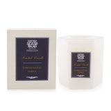 Luxurious Sandalwood Amber candle in soft white glass, featuring a complex, warm fragrance and 60 hours of soothing illumination.