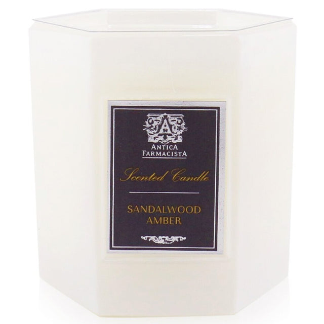 Luxurious Sandalwood Amber candle in soft white glass, offering 60 hours of rich, complex fragrance for a warm atmosphere.
