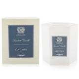 Luxurious Santorini Candle in elegant glass, offering 60 hours of citrus-green fragrance with floral and wood notes.