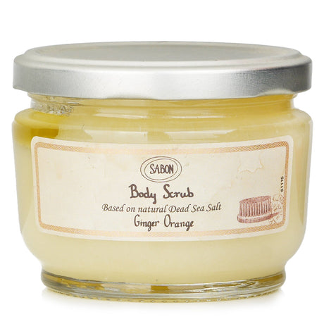 Luxurious Sabon Body Scrub in Ginger Orange with Dead Sea Salt for radiant skin, enriched with soy and almond oils.
