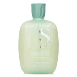 Sulfate-free micellar shampoo soothing sensitive scalps, restoring balance for soft, shiny hair.