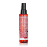 Redken Frizz Dismiss Anti-Static Oil Mist in 125ml, designed to smooth frizzy hair and reduce static with Babassu Oil.