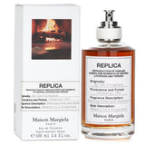 Maison Margiela's Replica By The Fireplace 100ml, a unisex woody fragrance evoking cozy winter evenings with sweet, spicy notes.