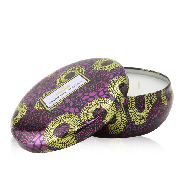 Voluspa 3 wick candle in metallic tin, scent of huckleberry, clean coconut wax, 40-hour burn, decorative home accent.