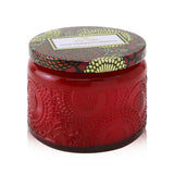 A petite jar candle with Goji and Tarocco Orange scents, eco-friendly coconut wax, and ornate Japanese-inspired design.