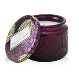 Voluspa Santiago Huckleberry candle in a decorative jar, emits a sweet, fruity aroma with a burn time of 25 hours.