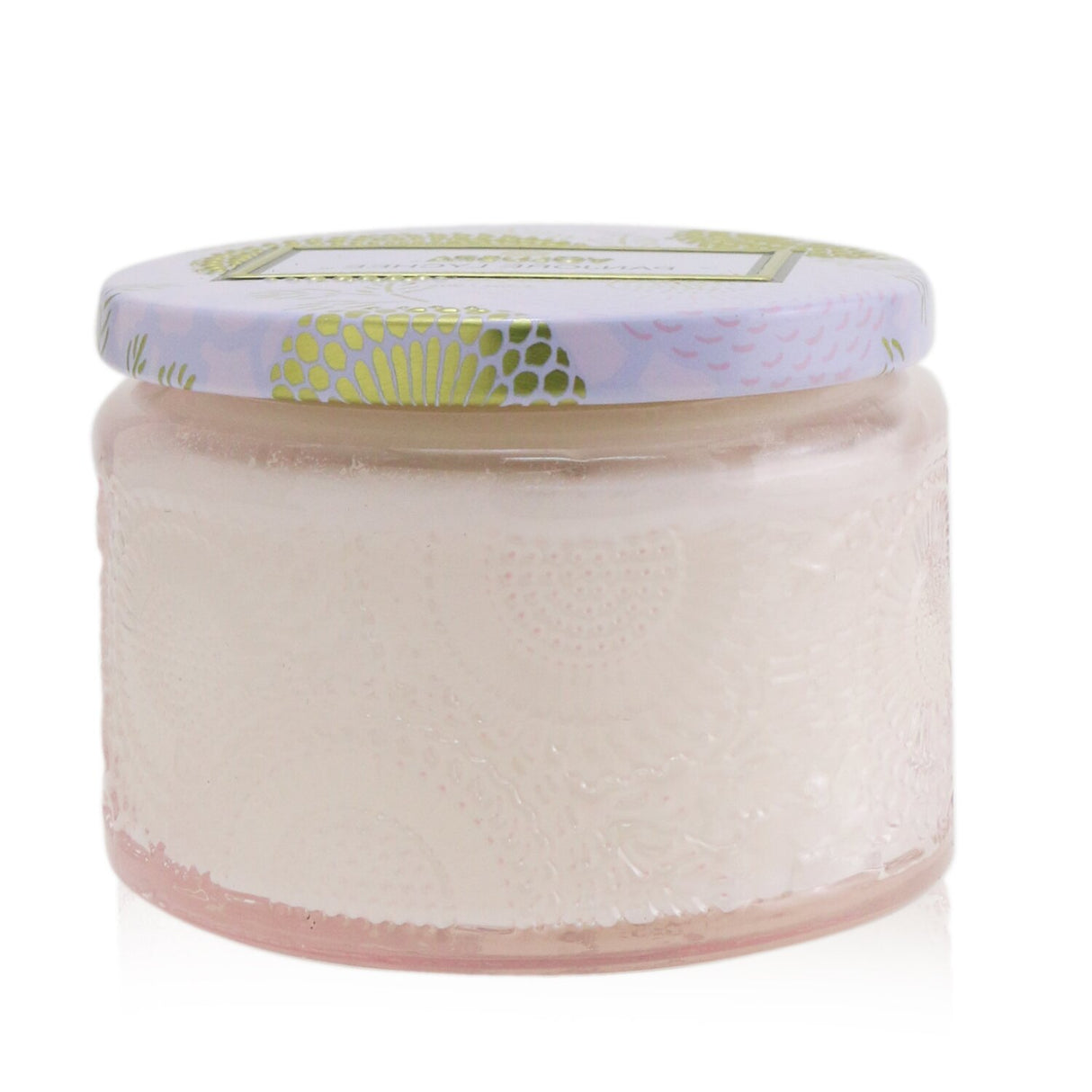 Voluspa's Panjore Lychee Petite Jar Candle in a colorful, ornate container, offering a tropical lychee scent and 25-hour burn time.