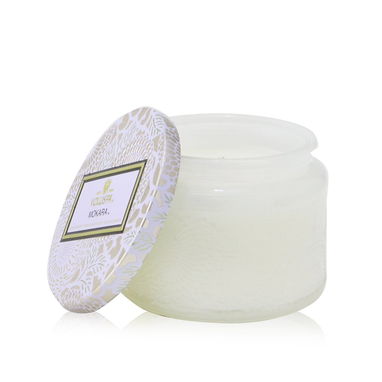 Petite jar candle with floral fragrance, coconut wax blend, and ornate Japanese-inspired design; ideal for home decor.
