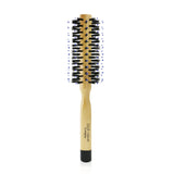 Elegant blow-dry brush designed for fine to medium-length hair, creates volume and shine while controlling frizz.