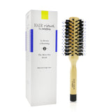 Round brush for blow-drying thick and curly hair, featuring wild boar bristles for softness, shine, and frizz control.