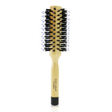 Round hair brush for easy straightening and creating soft waves, made with gentle wild boar bristles for shiny, frizz-free hair.