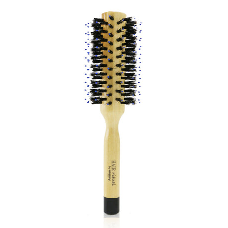 Round hair brush for easy straightening and creating soft waves, made with gentle wild boar bristles for shiny, frizz-free hair.