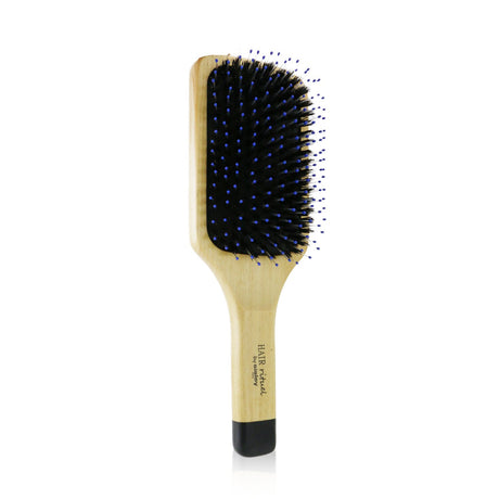 Premium hairbrush with supple bristles for gentle detangling and scalp stimulation, promoting soft and radiant hair.