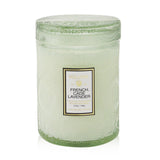 Voluspa small jar candle in French Cade Lavender, featuring a chic glass container and a soothing aromatic blend for serene ambiance.
