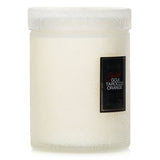 Voluspa Small Jar Candle in Spiced Goji Tarocco Orange, featuring a coconut wax blend and elegant glass container for a cozy ambiance.
