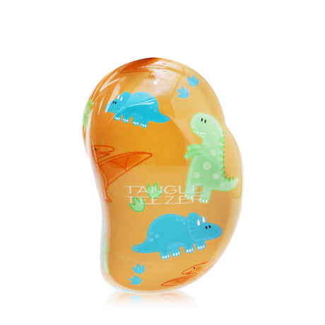 Mini Tangle Teezer hair brush in playful dinosaur design for effortless detangling, leaving hair smooth and frizz-free.