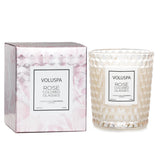 Elegant Voluspa Classic Candle in rose-colored glass, featuring a floral scent, coconut wax blend, and geometric design.