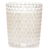 Elegant Voluspa Classic Candle in rose-colored glass, with floral aroma, coconut wax blend, 40-hour burn time, and geometric design.