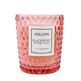 Elegant Voluspa Blackberry Rose Oud candle in a geometric glass container with a romantic floral fragrance and 40-hour burn time.