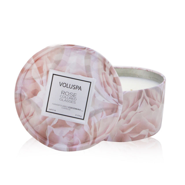 Luxury Voluspa 2 Wick Tin Candle in rose-colored glass with geometric design, offers 25 hours of heavenly rose fragrance.