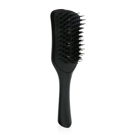 Jet Black vented blow-dry brush designed for quick detangling and frizz-free styling, enhancing bounce and shine.