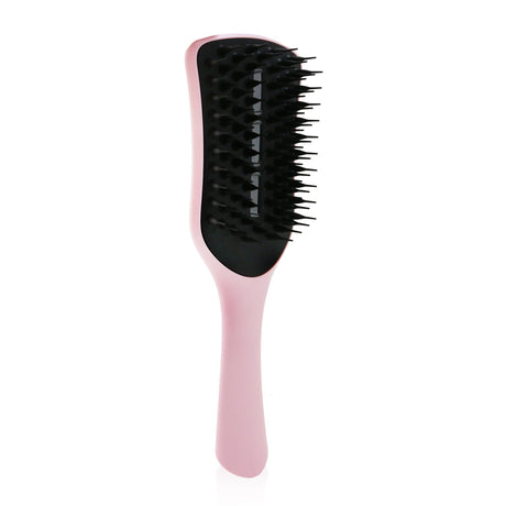 Vented blow-dry brush in #Tickled Pink for frizz-free styling and a smooth, shiny finish; ideal for all hair types.