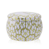 Elegant Voluspa Mini Tin Candle in Suede Blanc, featuring a coconut wax blend, natural wicks, and a vibrant metal tin.