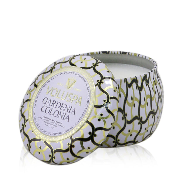 Mini tin candle in Gardenia Colonia scent, crafted from coconut wax, burns for 25 hours in a beautifully adorned metal tin.