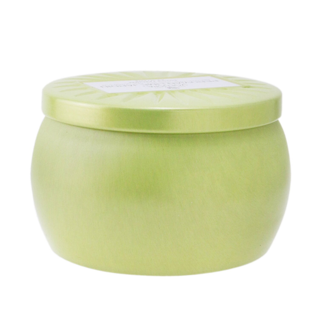 A vibrant Voluspa Mini Tin Candle in Peruvian Lime Jardin, featuring a clean coconut wax blend and ornate Japanese-inspired tin.