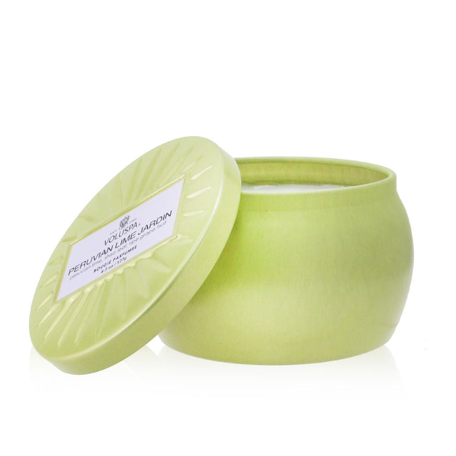 Voluspa Mini Tin Candle in Peruvian Lime Jardin: vibrant tin design, eco-friendly coconut wax, natural wicks, 25-hour burn time.