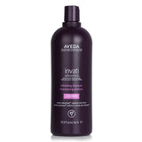 Aveda Invati Advanced Exfoliating Shampoo in a 1000ml bottle, designed for fine hair, purifies scalp and promotes healthy growth.