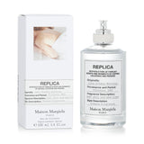 Maison Margiela Replica Lazy Sunday Morning Eau De Toilette Spray in a 100ml bottle, featuring a fresh floral woody scent for all.