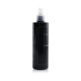 Bottle of PUROPHI Phi Slim Serum, an anti-cellulite body mist with caffeine and plant extracts for firmer skin.