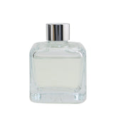 Elegant glass cube diffuser with engineered polymer sticks, releasing Hibiscus Love fragrance for a tropical ambiance.
