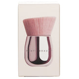 Luxurious kabuki brush for face and body, featuring soft synthetic bristles and a custom angled design for seamless blending.
