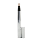 Sisley Stylo Lumiere Instant Radiance Booster Pen #6 Spice Gold enhances glow with light-refractive pigments and nourishing extracts.