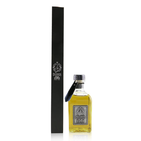 Elegant glass bottle diffuser with black reeds, releasing captivating aromas for a serene home atmosphere.