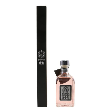 Elegant diffuser with black reeds in a glass bottle, offering a refreshing fragrance to elevate your home ambiance.