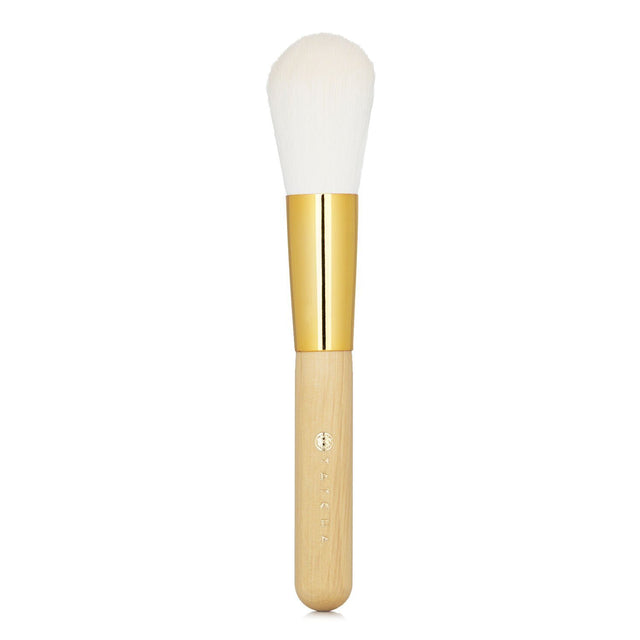 Tatcha Powder Brush with ergonomic design and lush synthetic bristles for flawless makeup application and even coverage.